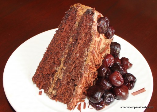 Topped with dark chocolate shavings and cherries.